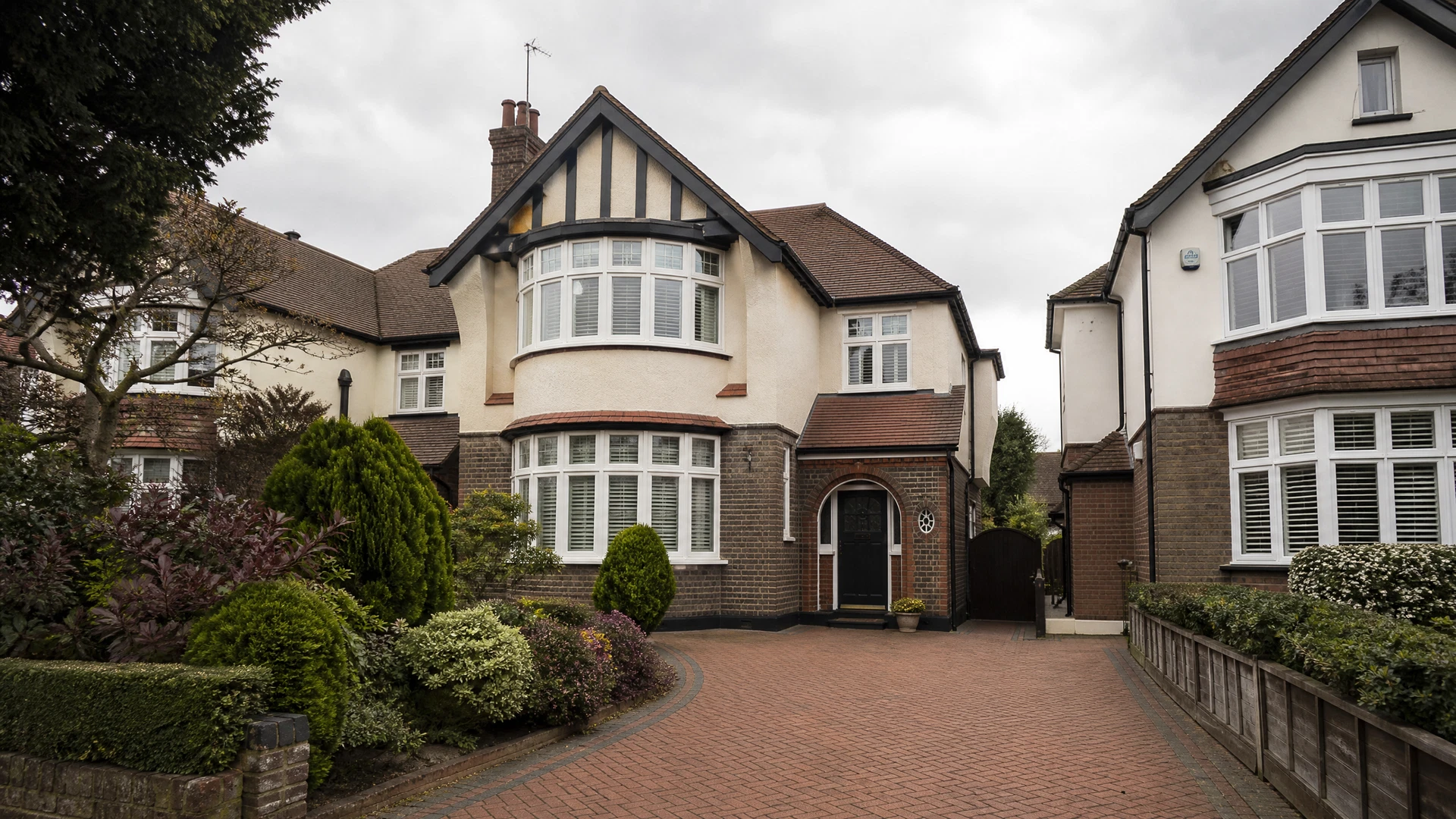 Detached family homes on a tree-lined street in Stanmore, Middlesex